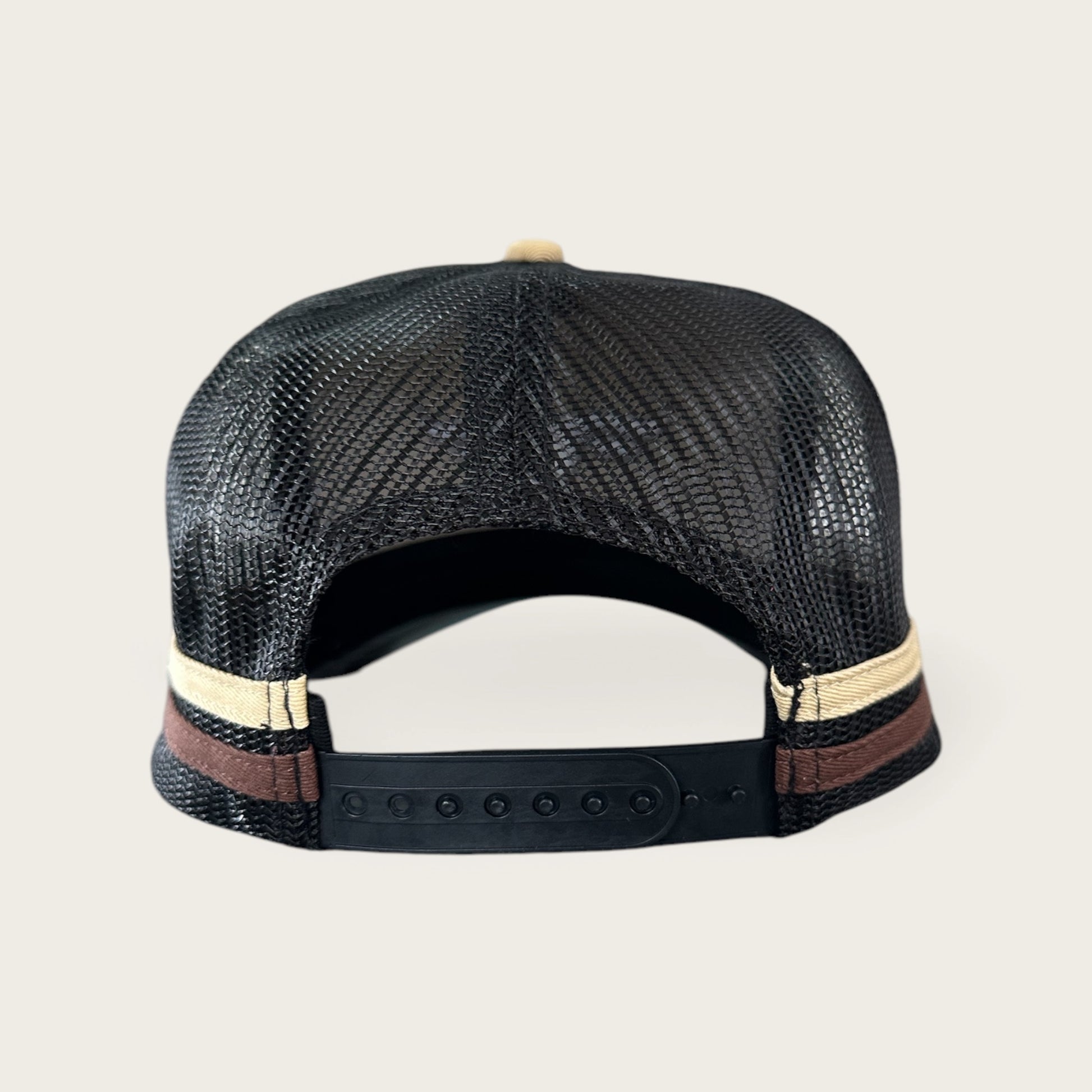 Beige and charcoal trucker cap with logo and photo under brim