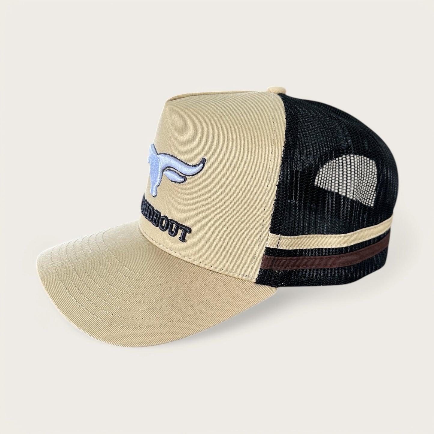 Beige and charcoal trucker cap with logo and photo under brim
