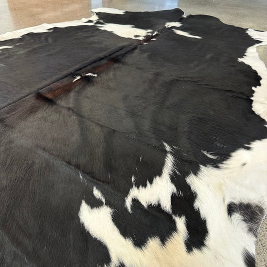 Large Premium Cowhide Rug in Black and White with Brown Ridge