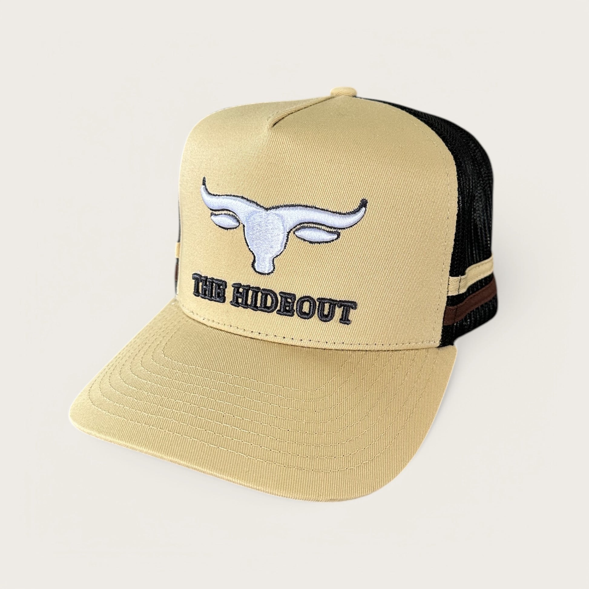 Beige and charcoal trucker cap with logo and photo under brim