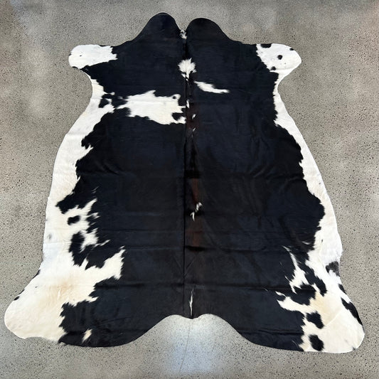 Large Premium Cowhide Rug in Black and White with Brown Ridge