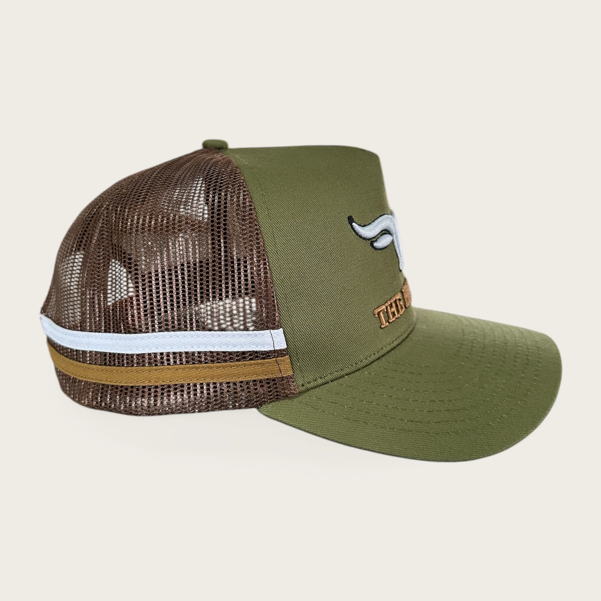 Green and brown trucker cap with logo and photo under brim