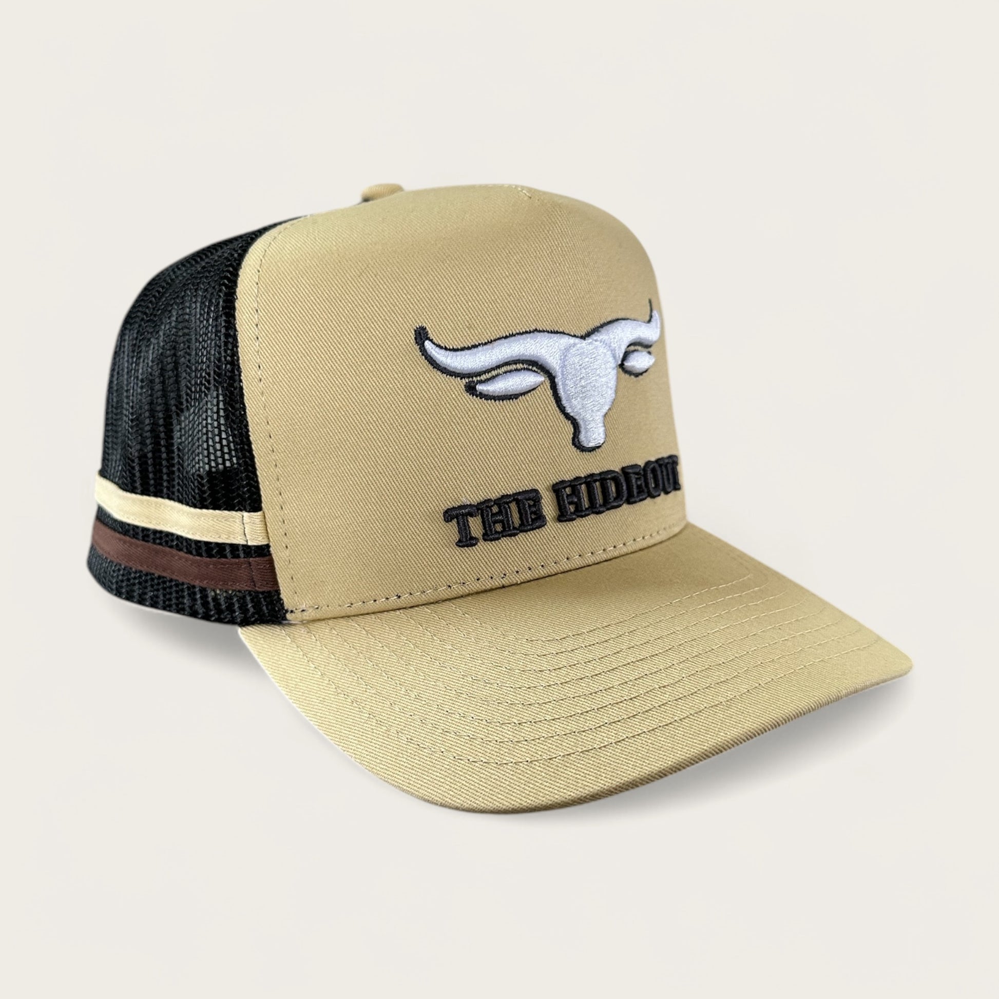 Beige and charcoal trucker cap with logo and photo under brim