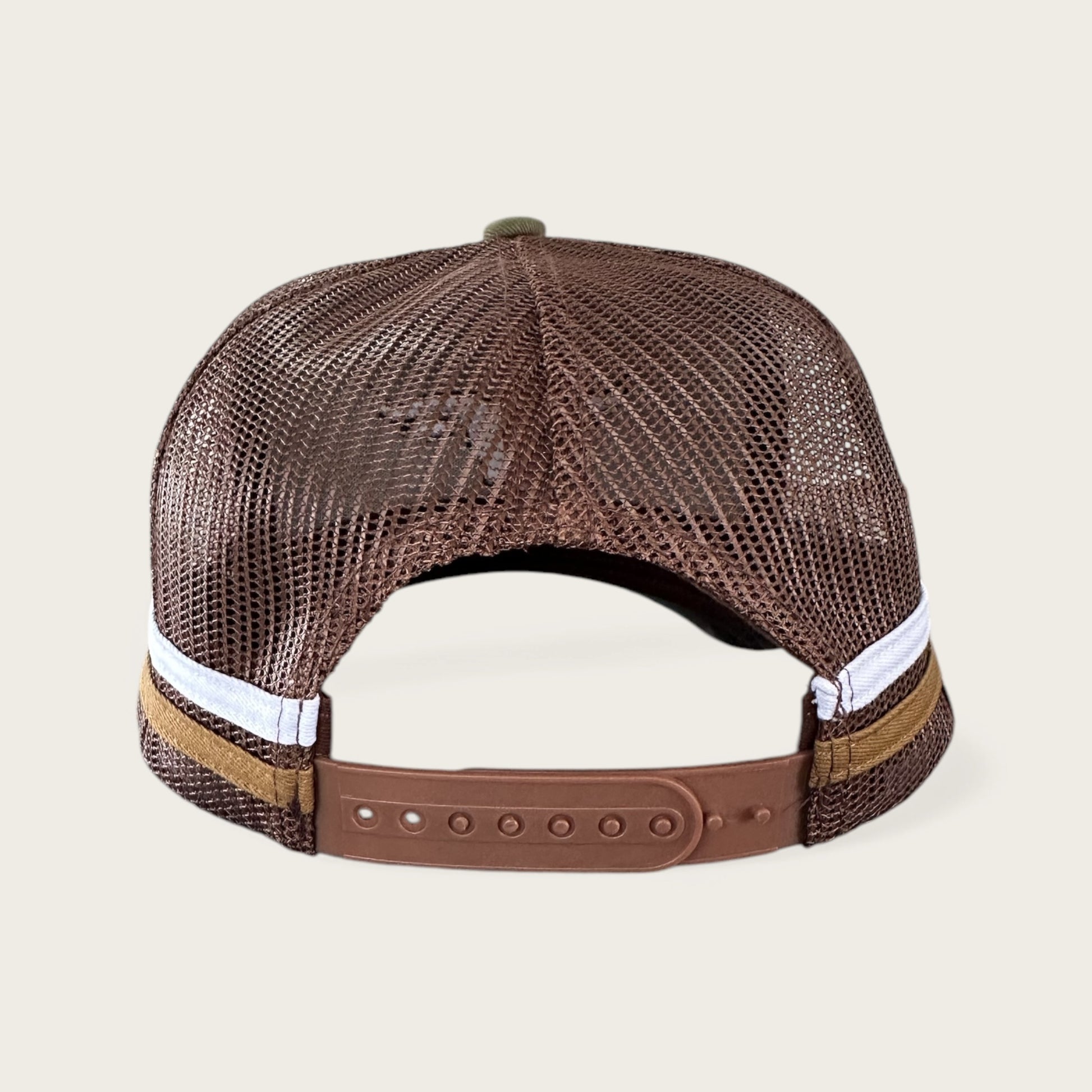 Green and brown trucker cap with logo and photo under brim