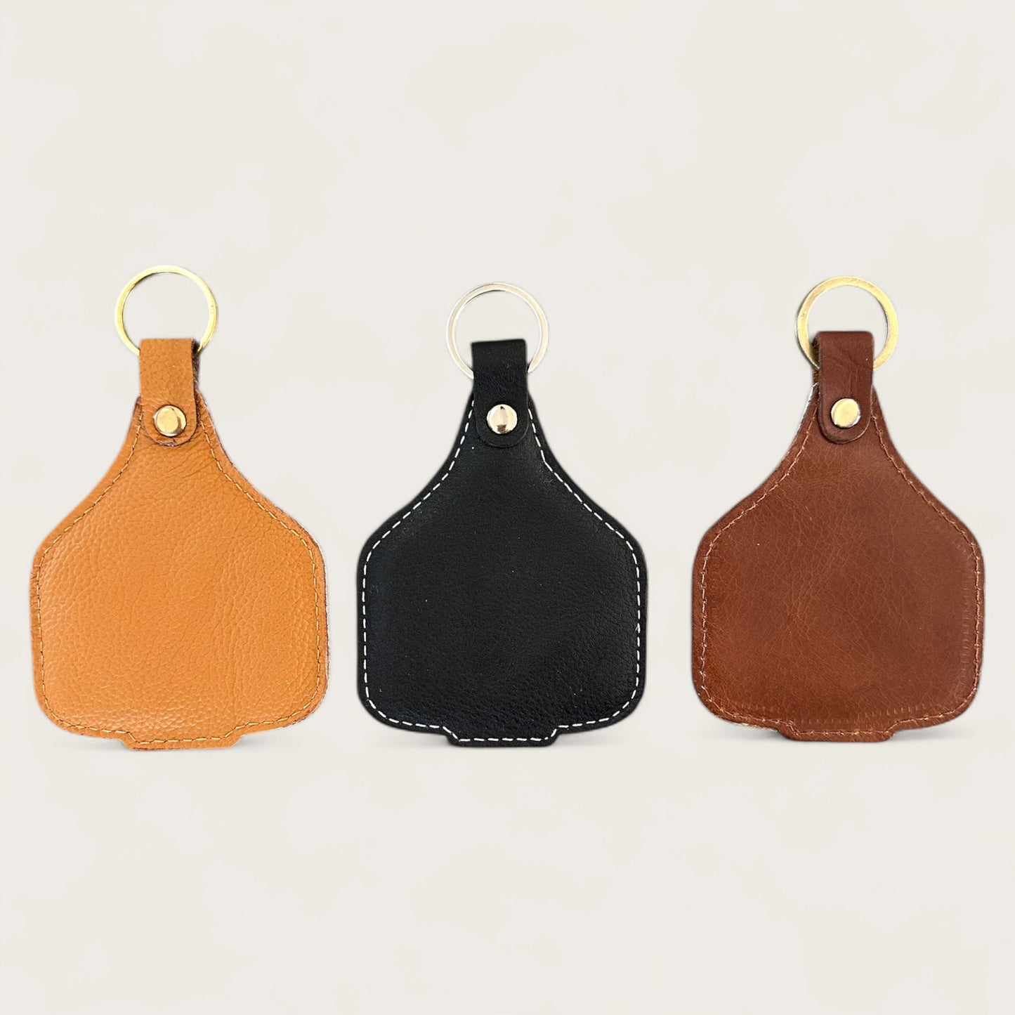 Extra large cowhide cattle tag keyring in tan, brown and black