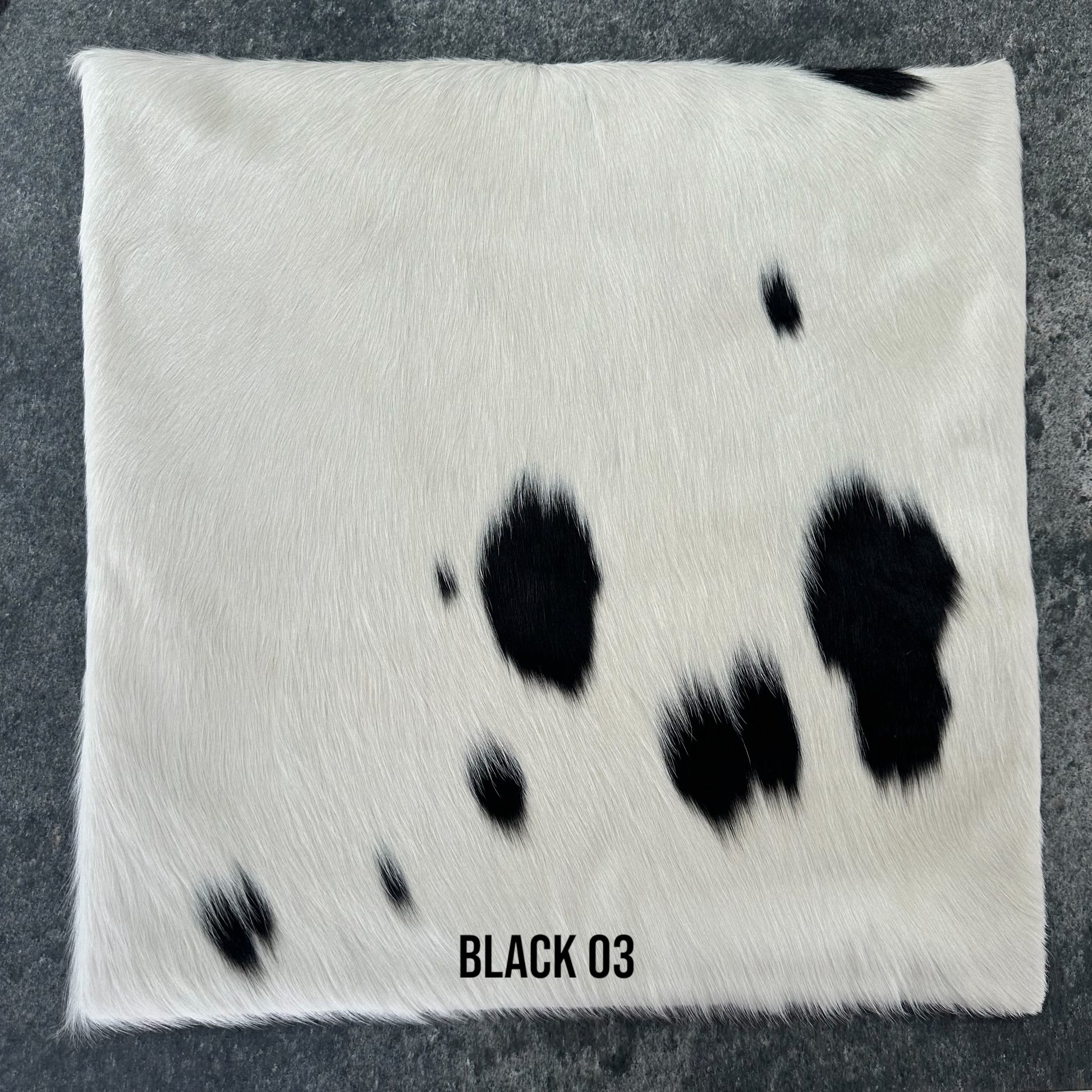 Black and white cowhide cushion