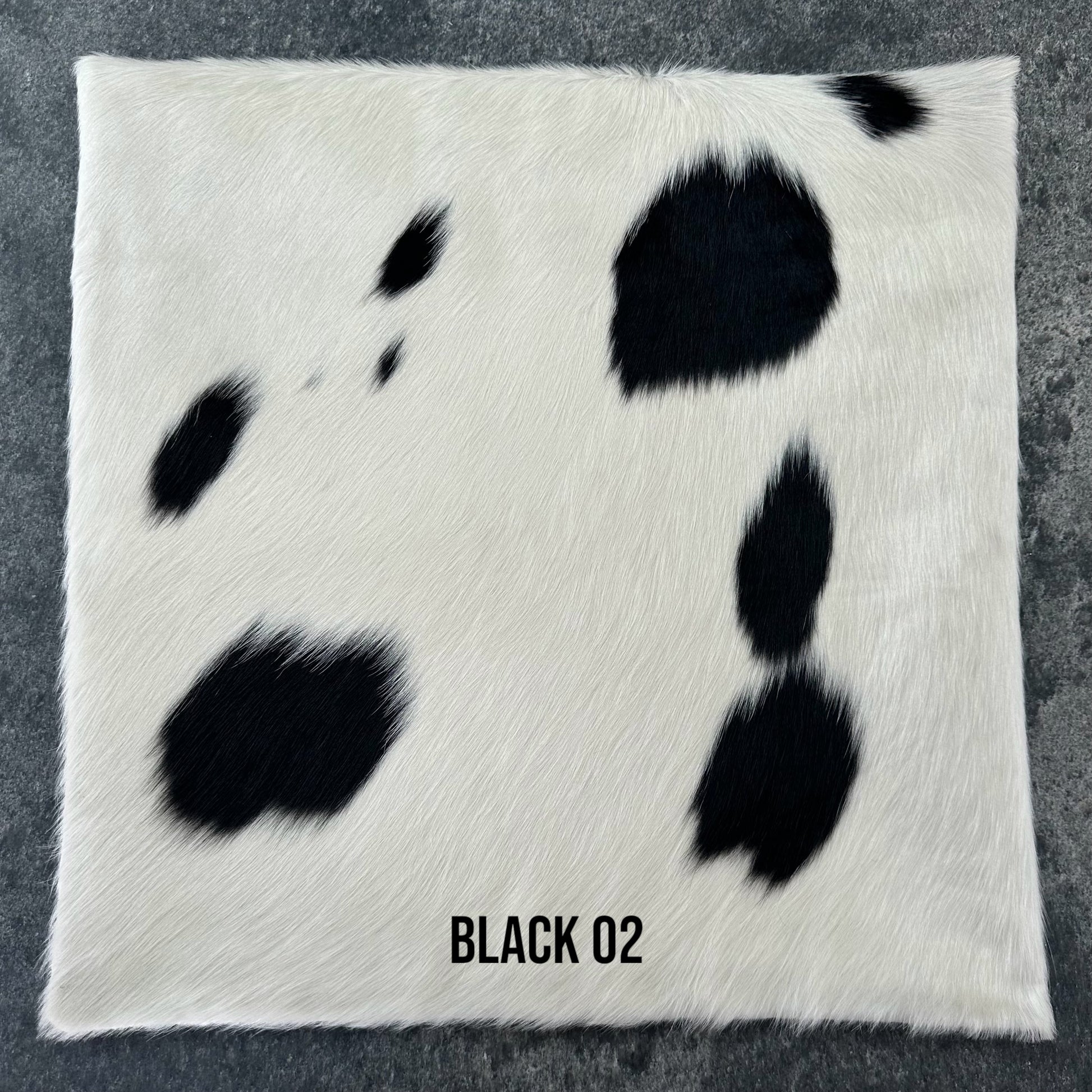Black and white cowhide cushion