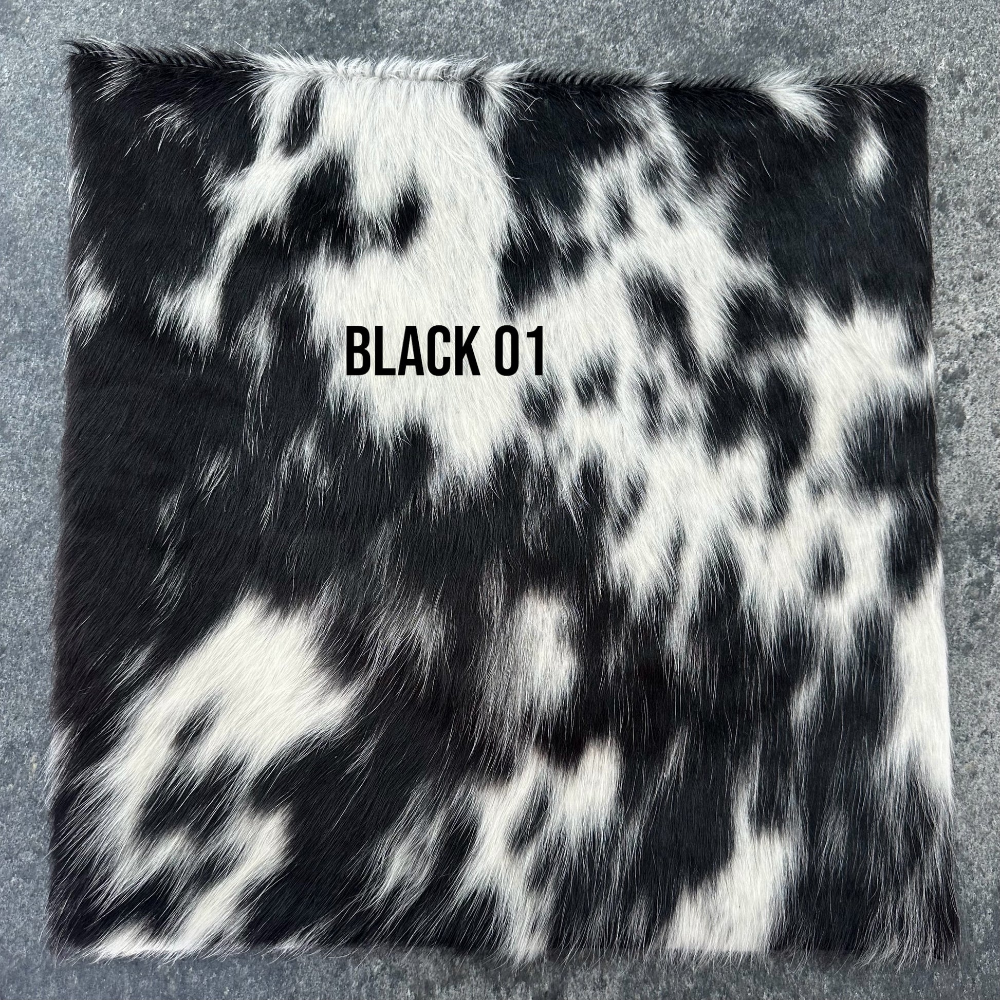 Black and white cowhide cushion