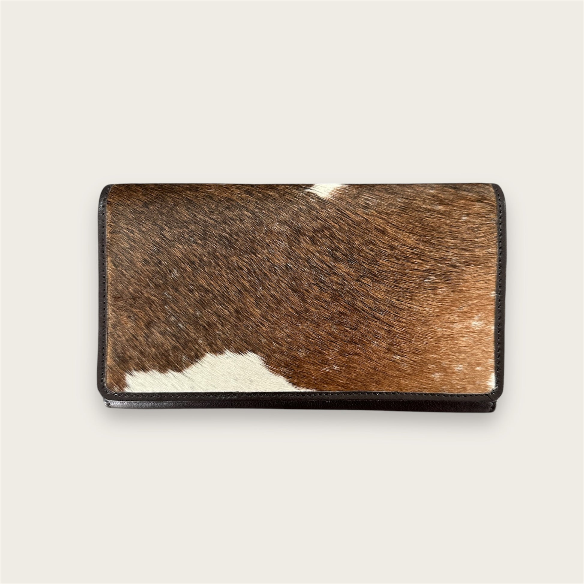 Large leather and cowhide wallet in brown and white