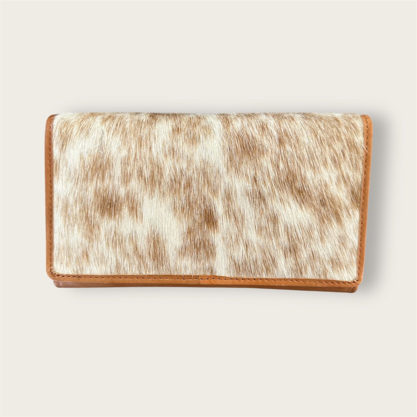 Large cowhide and leather wallet in tan and white