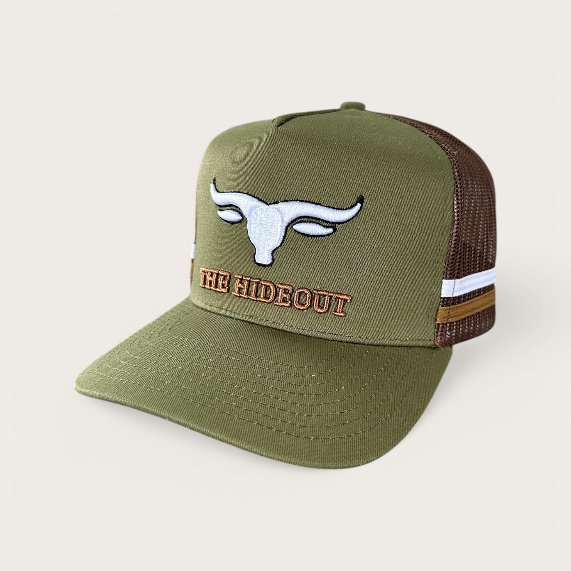 Green and brown trucker cap with logo and photo under brim
