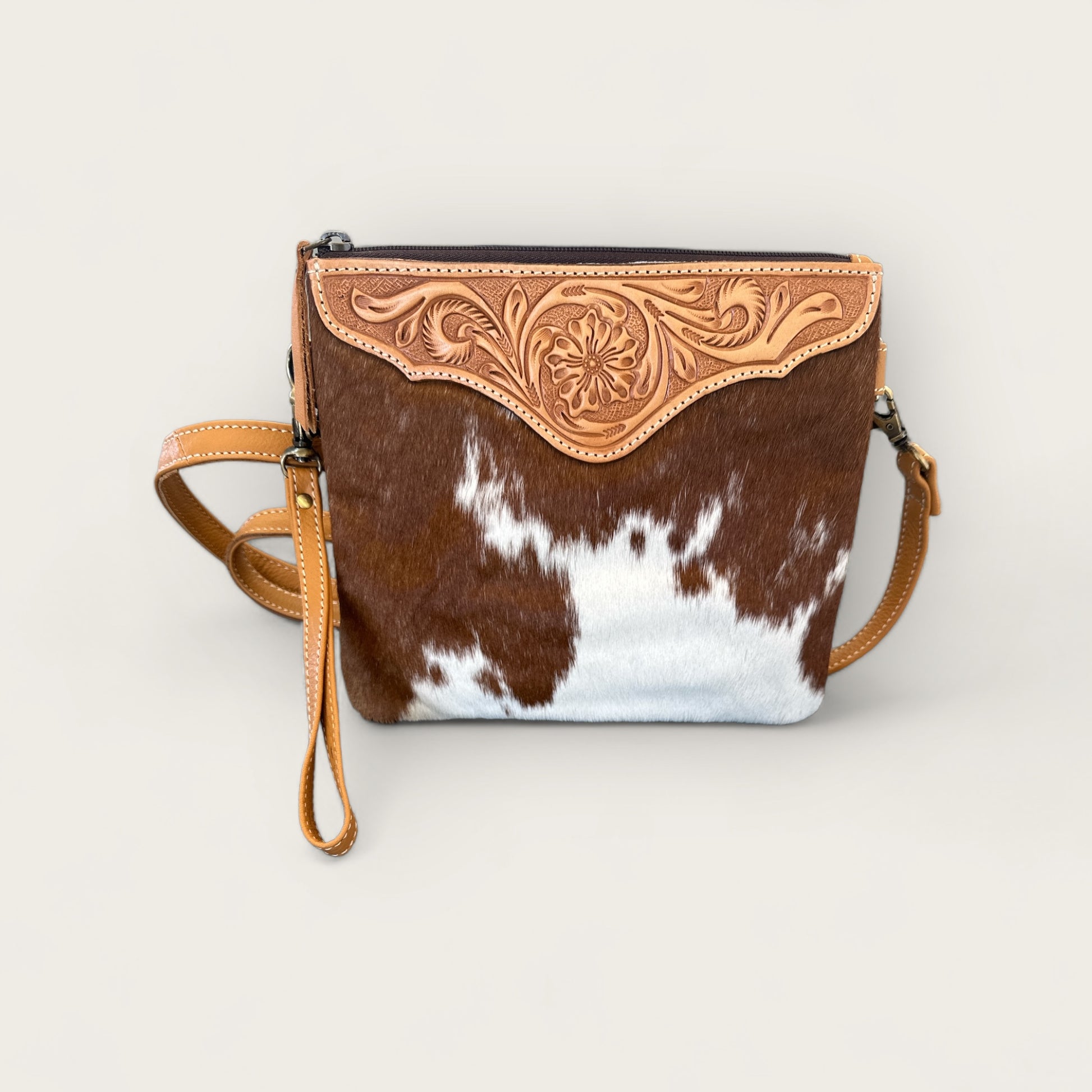 Cowhide and Leather Handbag with crafted tooling details in Tan and White