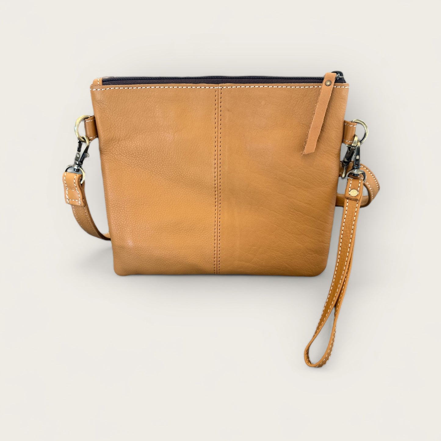 Cowhide and Leather Handbag with crafted tooling details in Tan and White