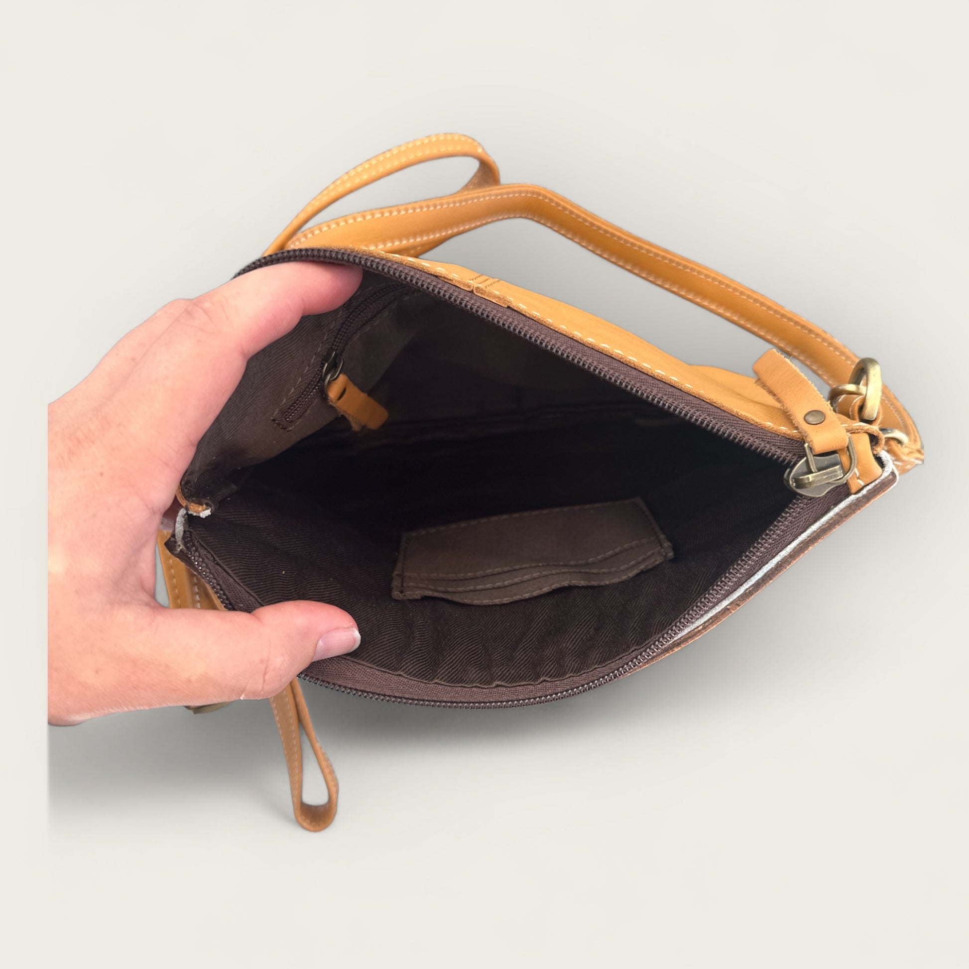 Cowhide and Leather Handbag with crafted tooling details in Tan and White