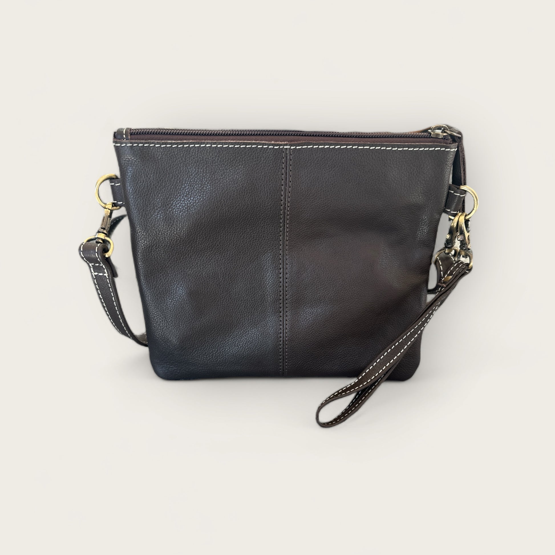 Cowhide and Leather Handbag with crafted tooling details in Brown and White