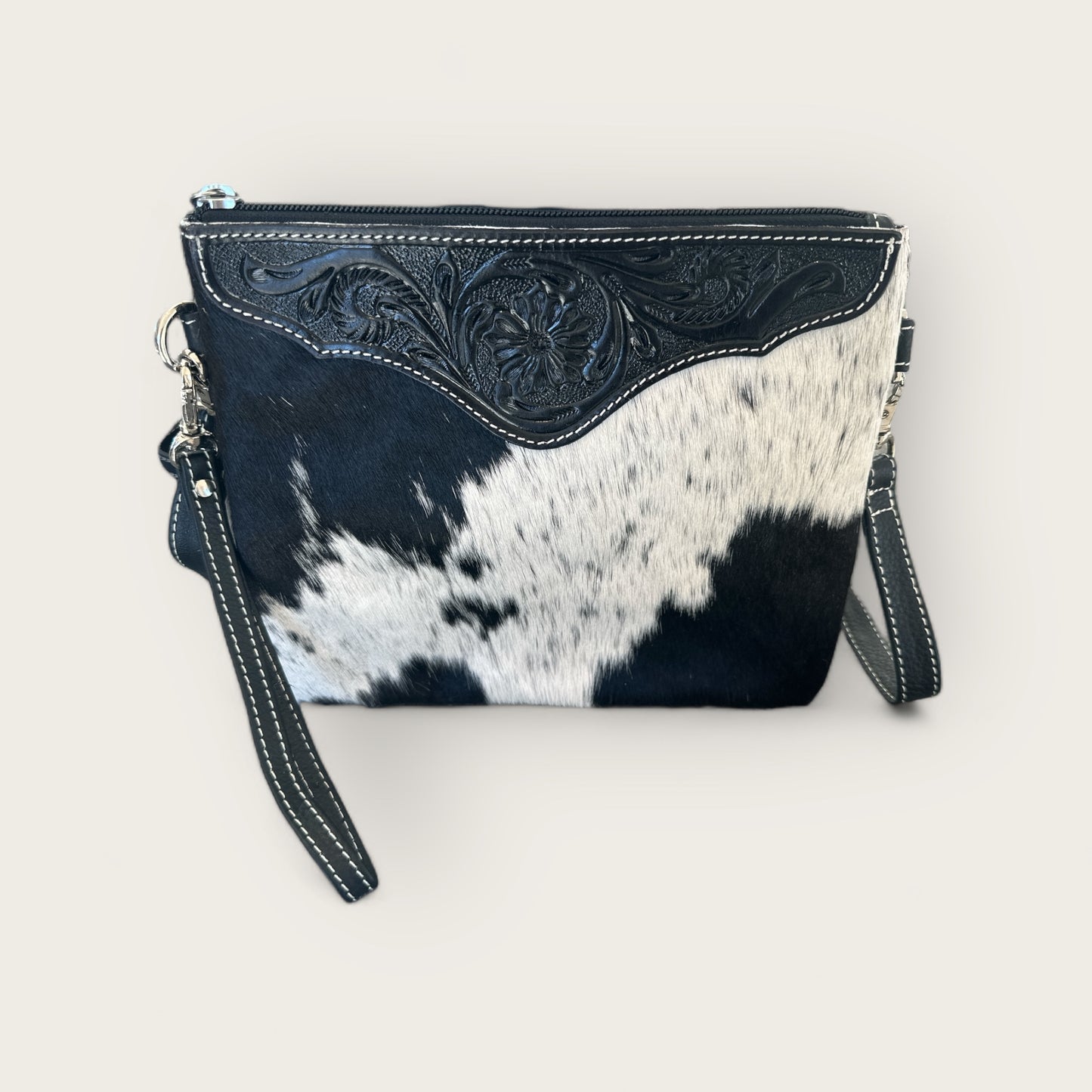Cowhide and Leather Handbag with crafted tooling details in Black and White