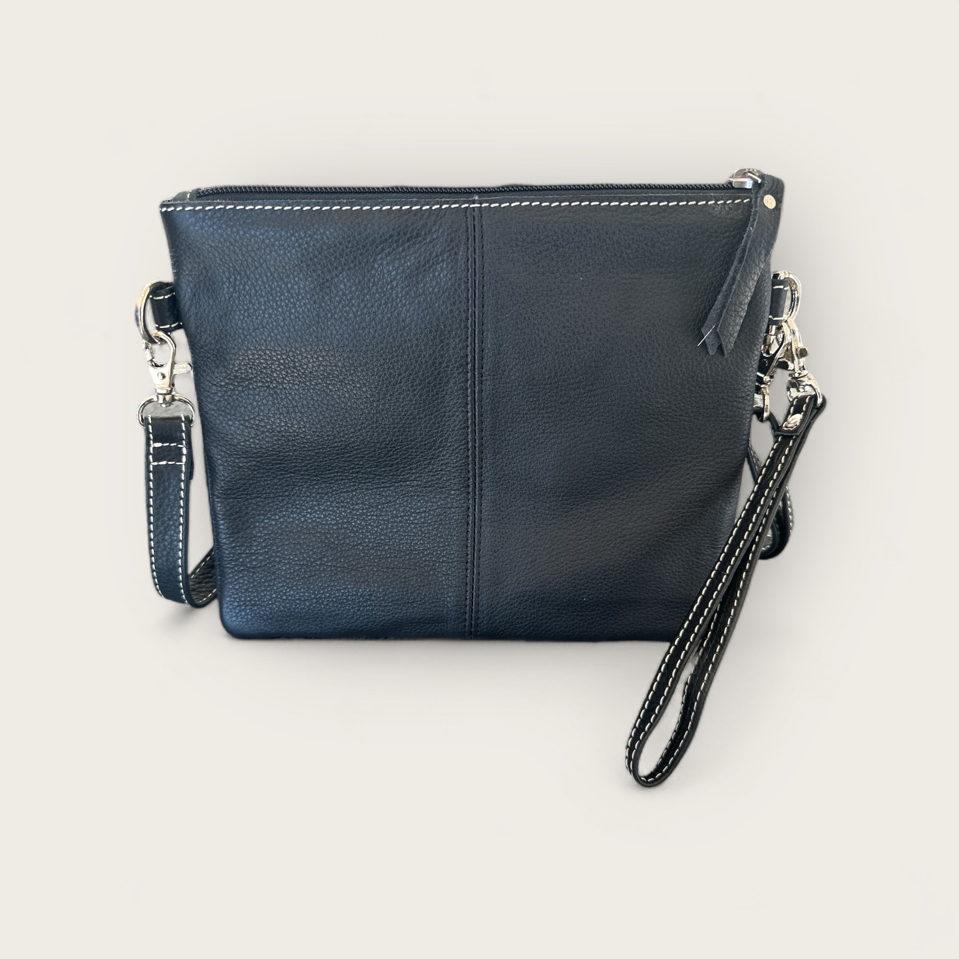 Cowhide and Leather Handbag with crafted tooling details in Black and White