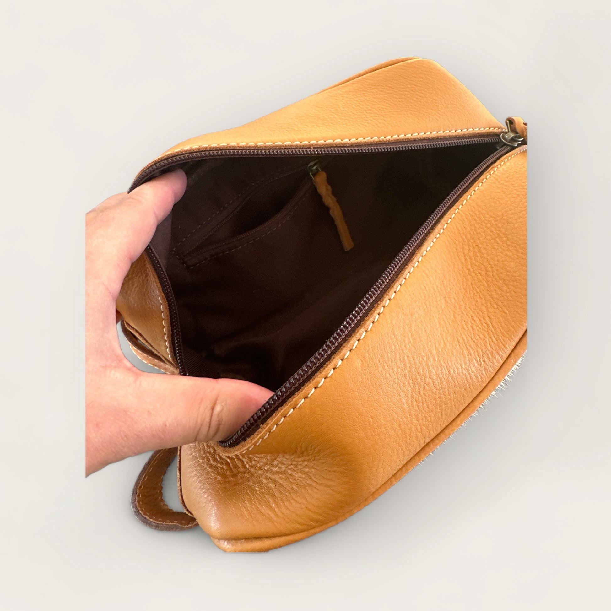 Cowhide and Leather Toiletry Bag with Tooling Details in Tan and White