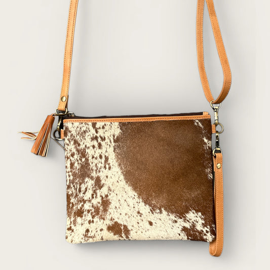 Cowhide and leather handbag or clutch in tan