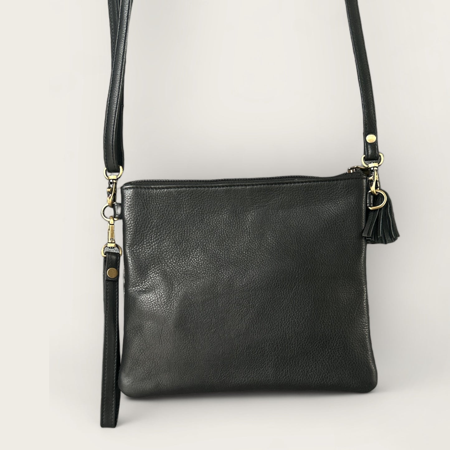 Cowhide and leather handbag or clutch in black