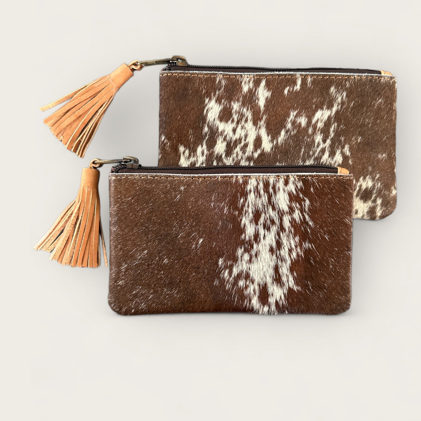Cowhide Purse with Tassel in Tan and White