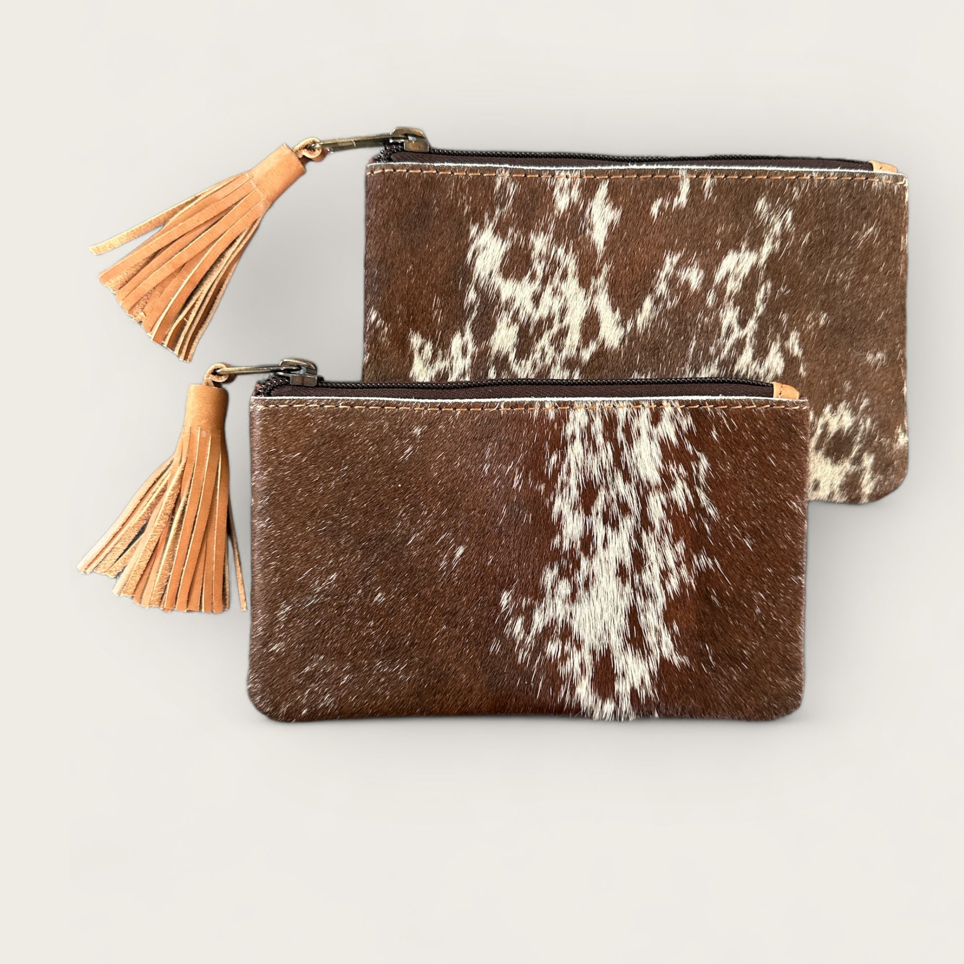 Cowhide Purse with Tassel in Tan and White