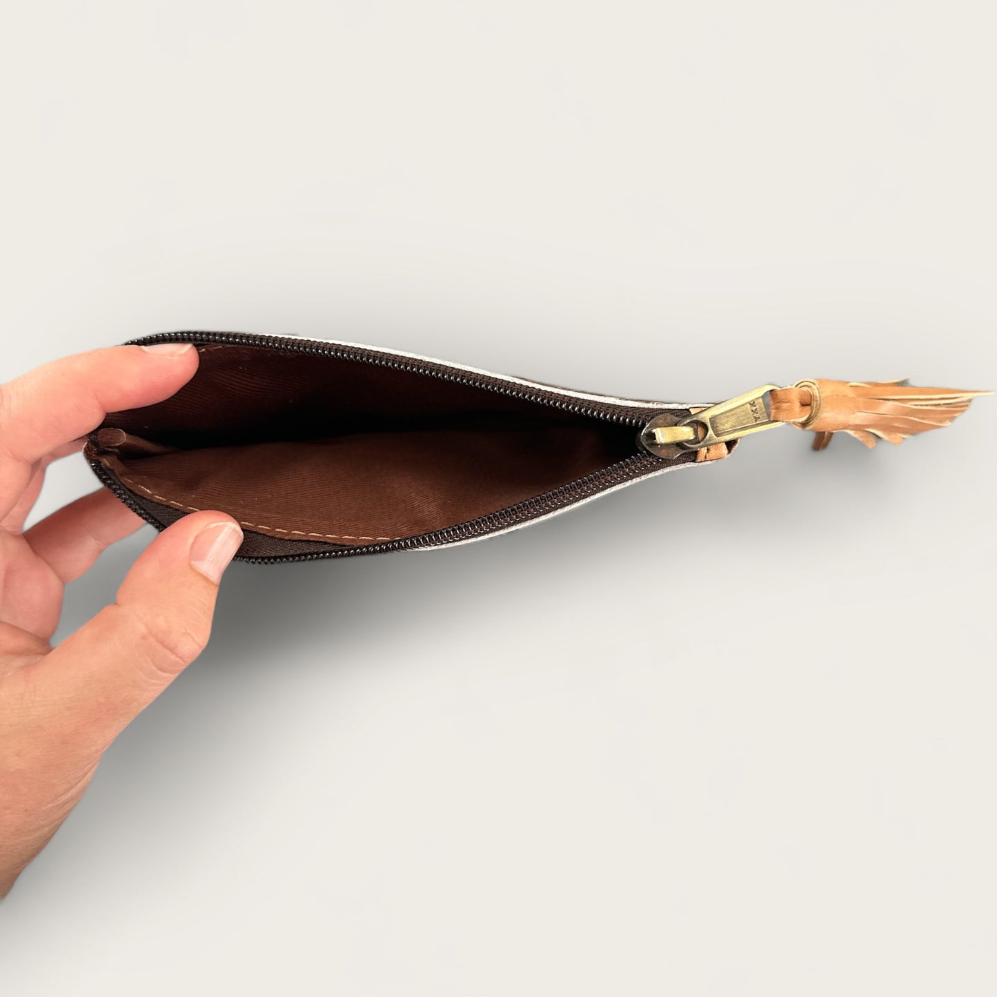 Cowhide Purse with Tassel in Tan and White