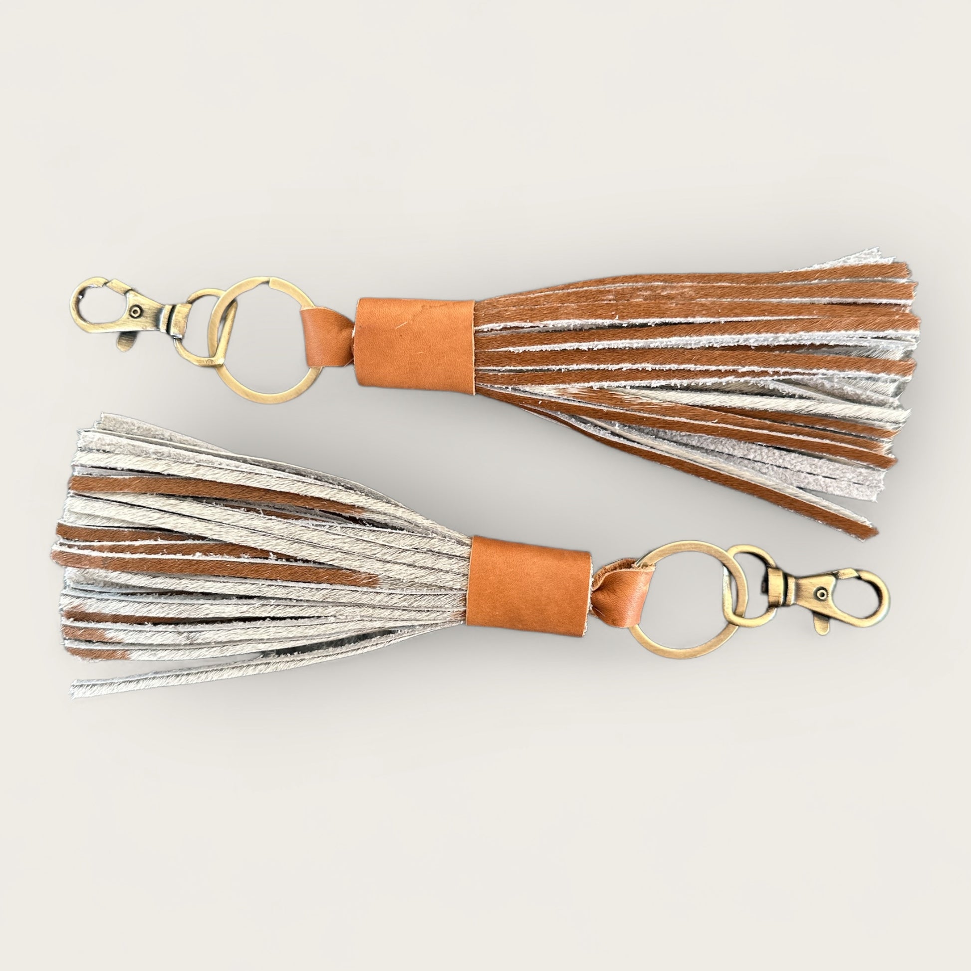 Cowhide and Leather Tassel Keyring in Tan and White