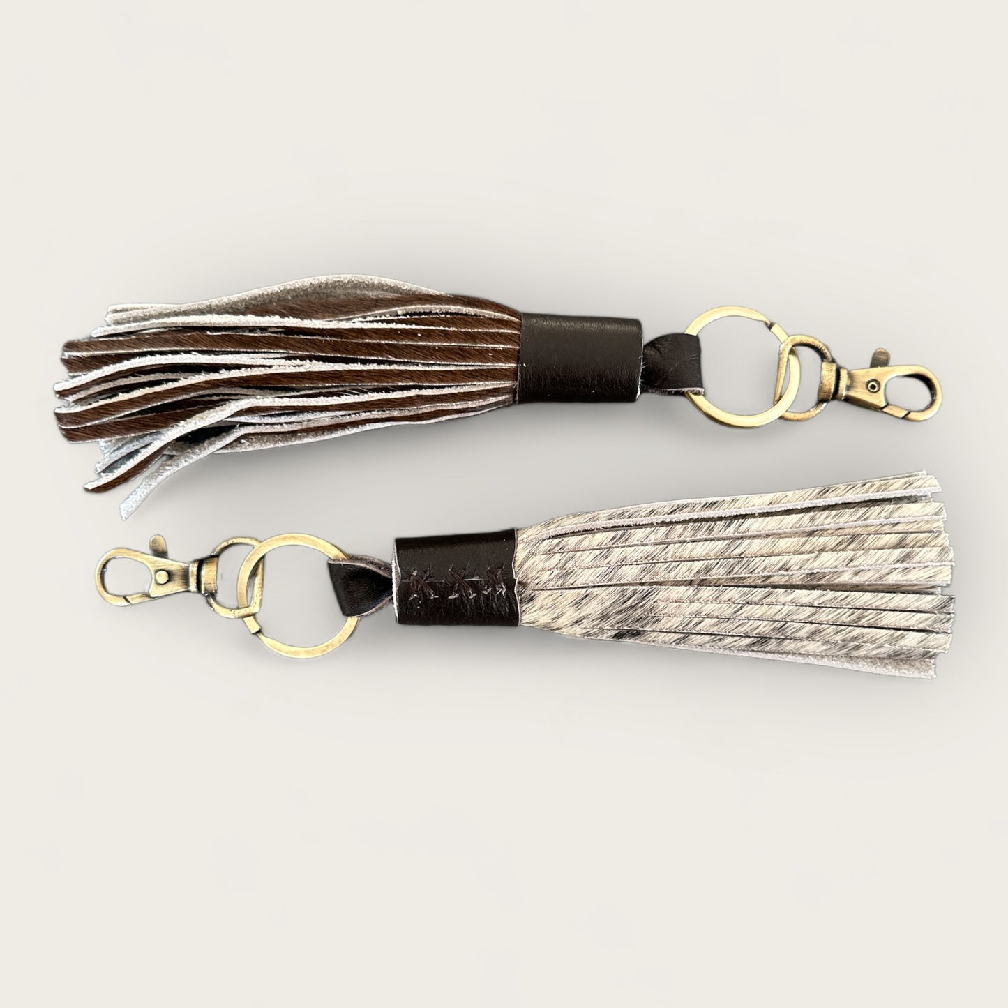 Cowhide and Leather Tassel Keyring in Brown and White