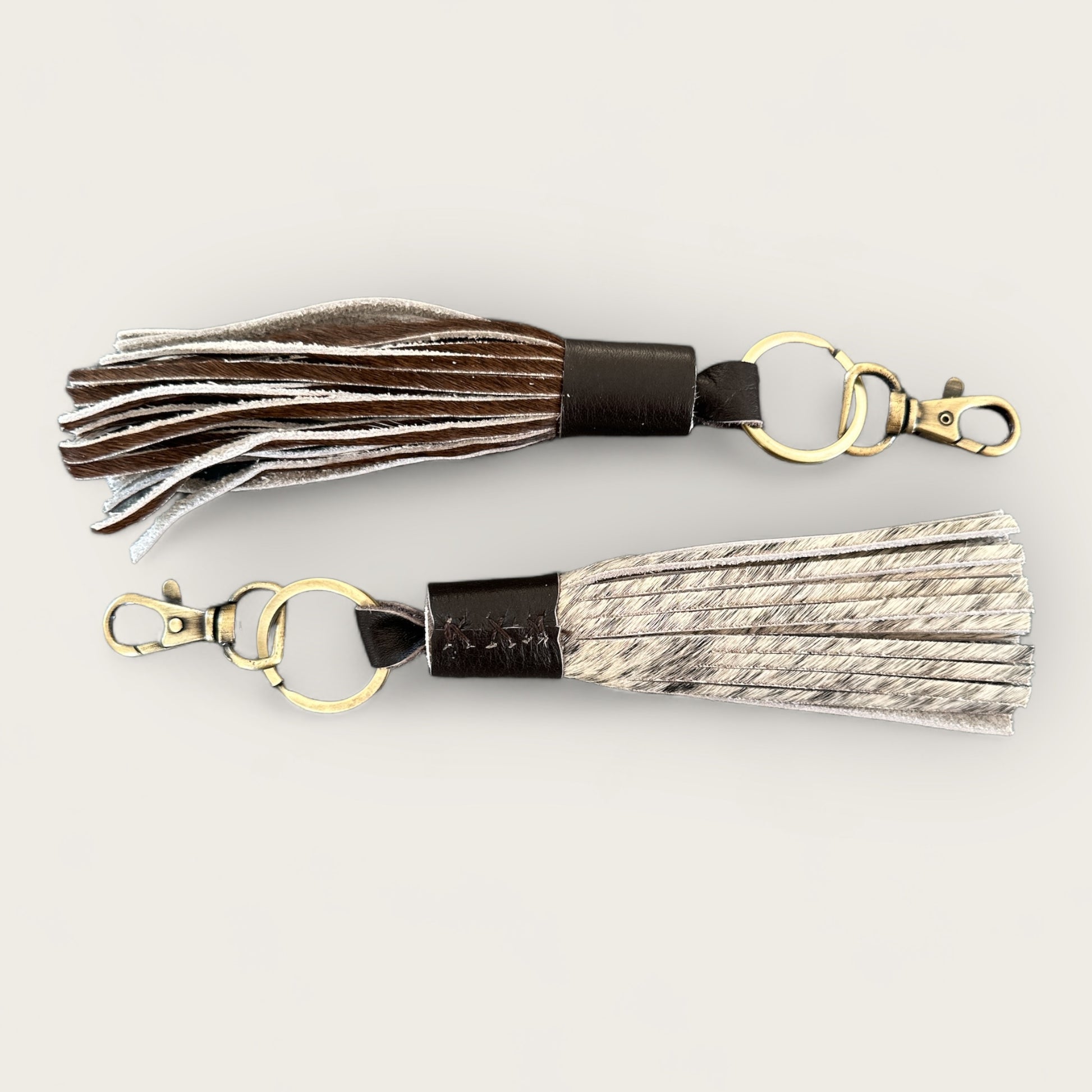 Cowhide and Leather Tassel Keyring in Brown and White