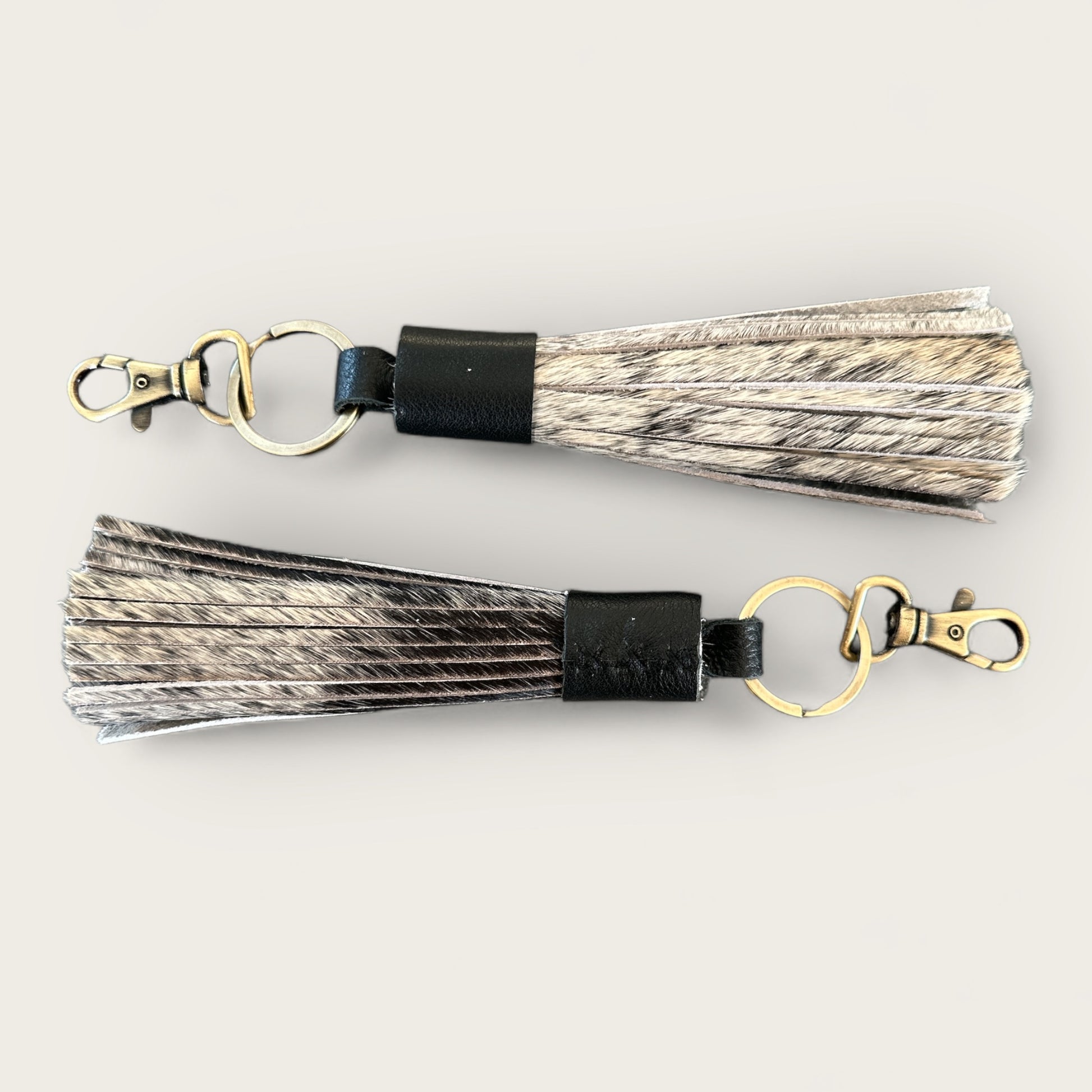 Cowhide and Leather Tassel Keyring in Black and White
