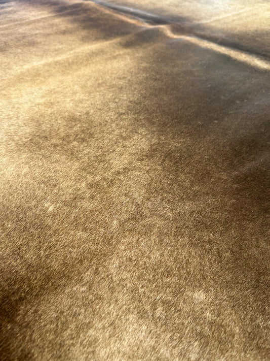 Large premium cowhide rug in brown and white