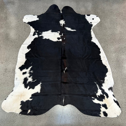 Large Premium Cowhide Rug in Black and White with Brown Ridge