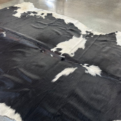 Large Premium Cowhide Rug in Black and White with Brown Ridge