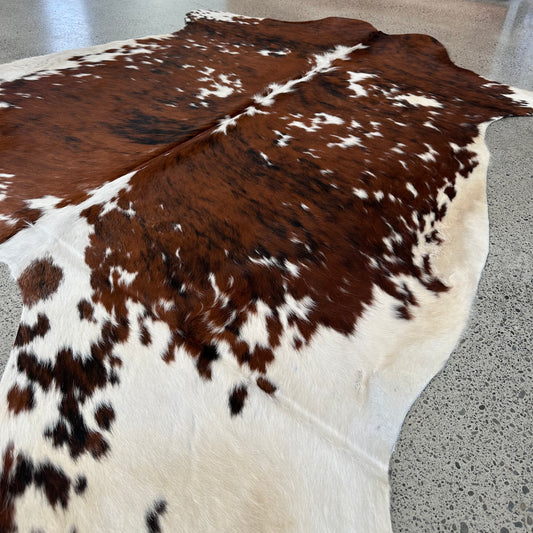 Large premium cowhide rug in brown, white and black 
