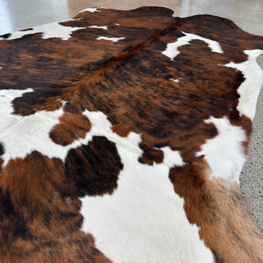 Large premium cowhide rug in brown, black and white