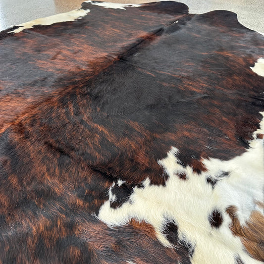 Large premium cowhide rug in brown, black and white 