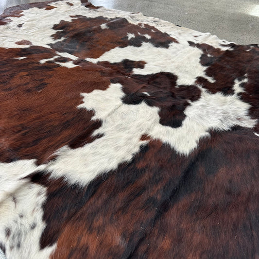 Large premium cowhide rug in brown, black and white 