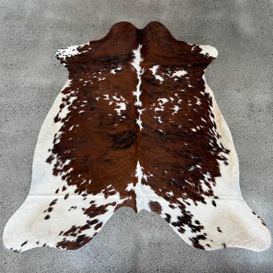 Large premium cowhide rug in brown, white and black 