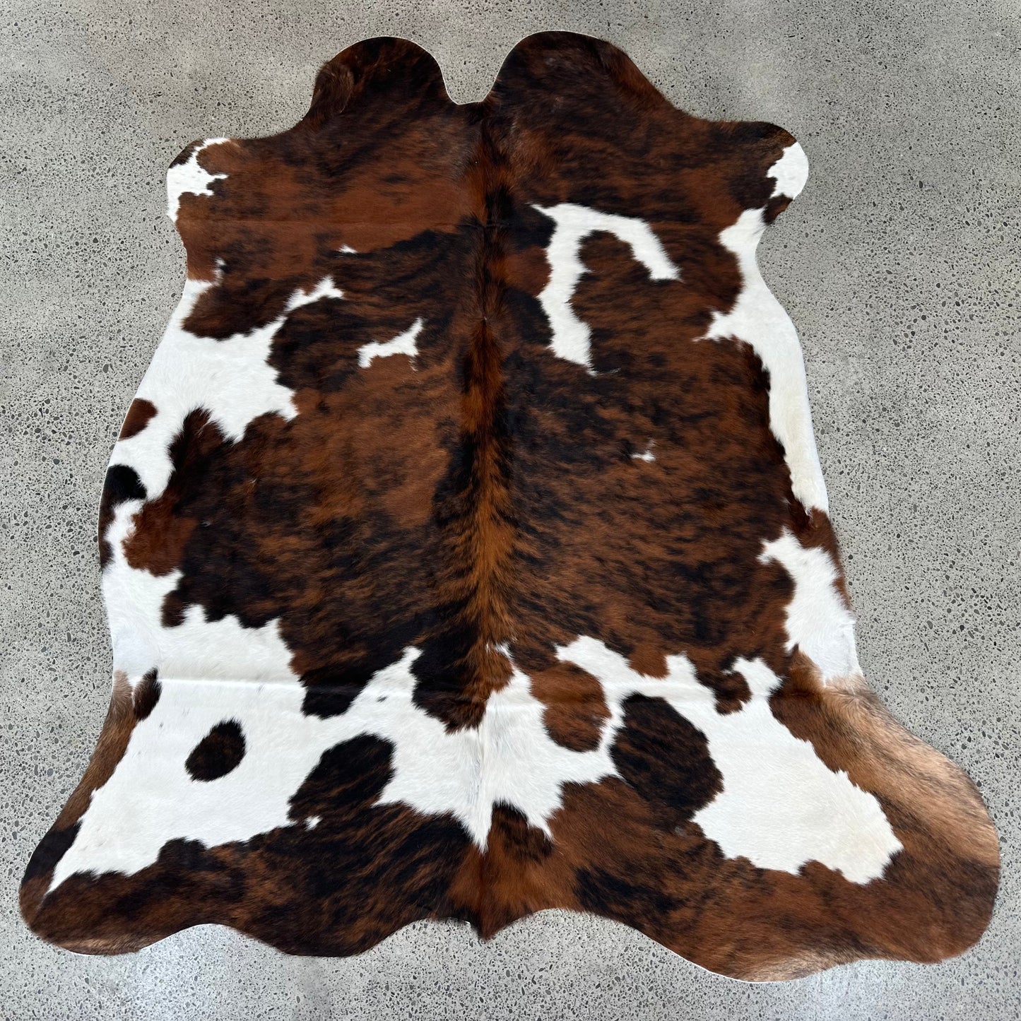 Large premium cowhide rug in brown, black and white