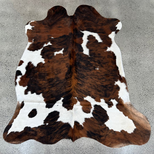 Large premium cowhide rug in brown, black and white