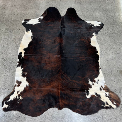 Large premium cowhide rug in brown, black and white 