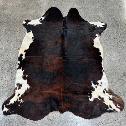 Large premium cowhide rug in brown, black and white 