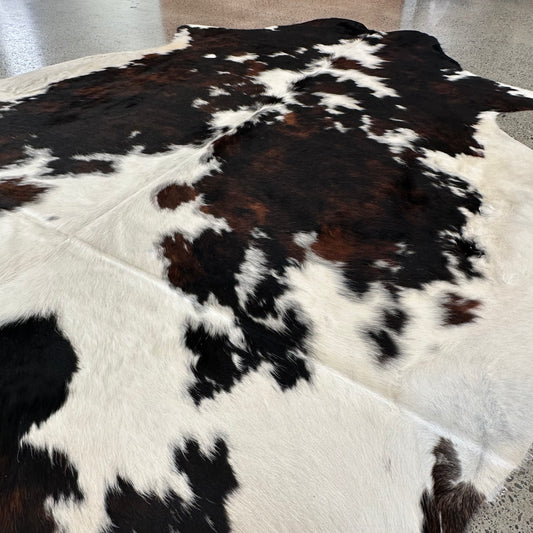 Large premium cowhide rug in black, brown and white