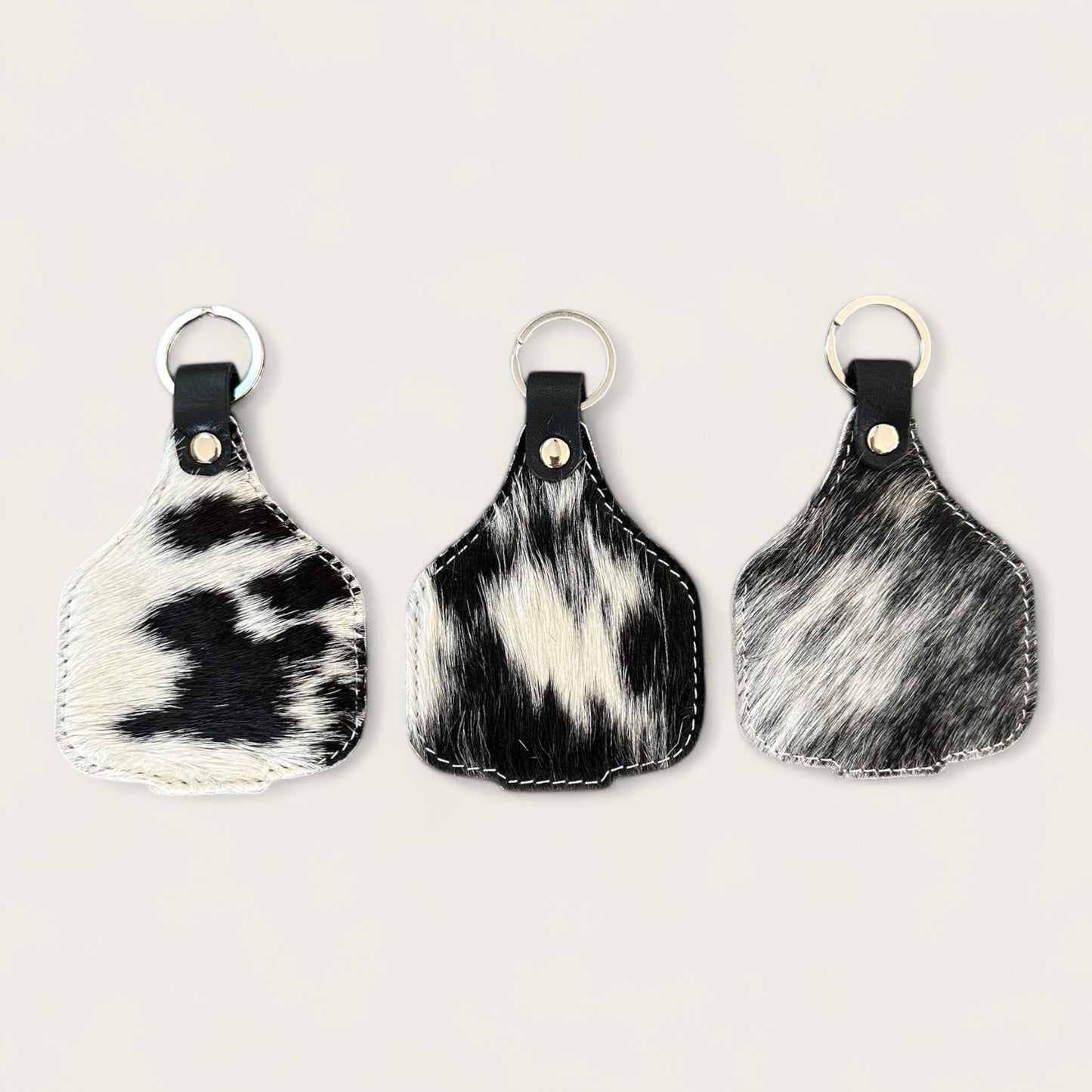 Extra large cowhide cattle tag keyring in black and white 