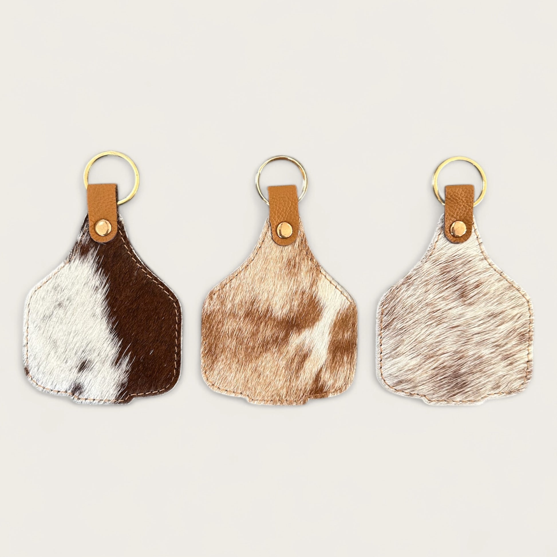Extra large cowhide cattle tag keyring in tan and white 