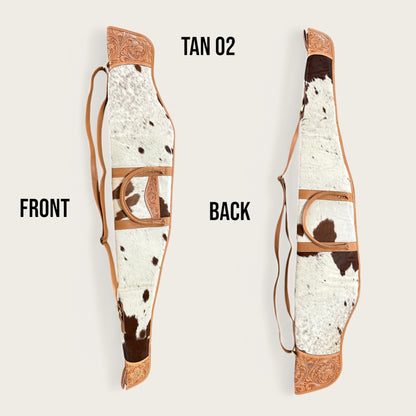 Cowhide and leather rifle gun bag in tan and white with tooling details