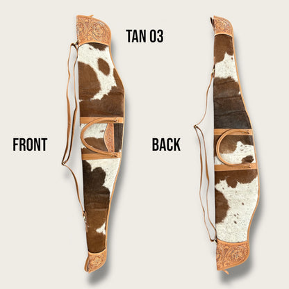 Cowhide and leather rifle gun bag in tan and white with tooling details