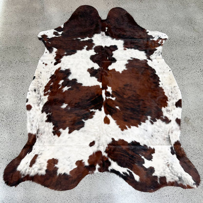 Large premium cowhide rug in brown, black and white 