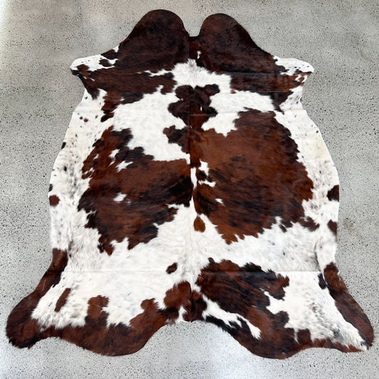 Large premium cowhide rug in brown, black and white 